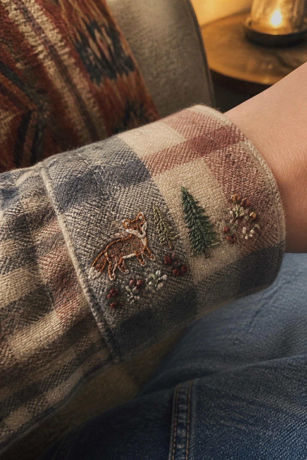 Plaid flannel cuff embroidered with fox, pine trees, and berries