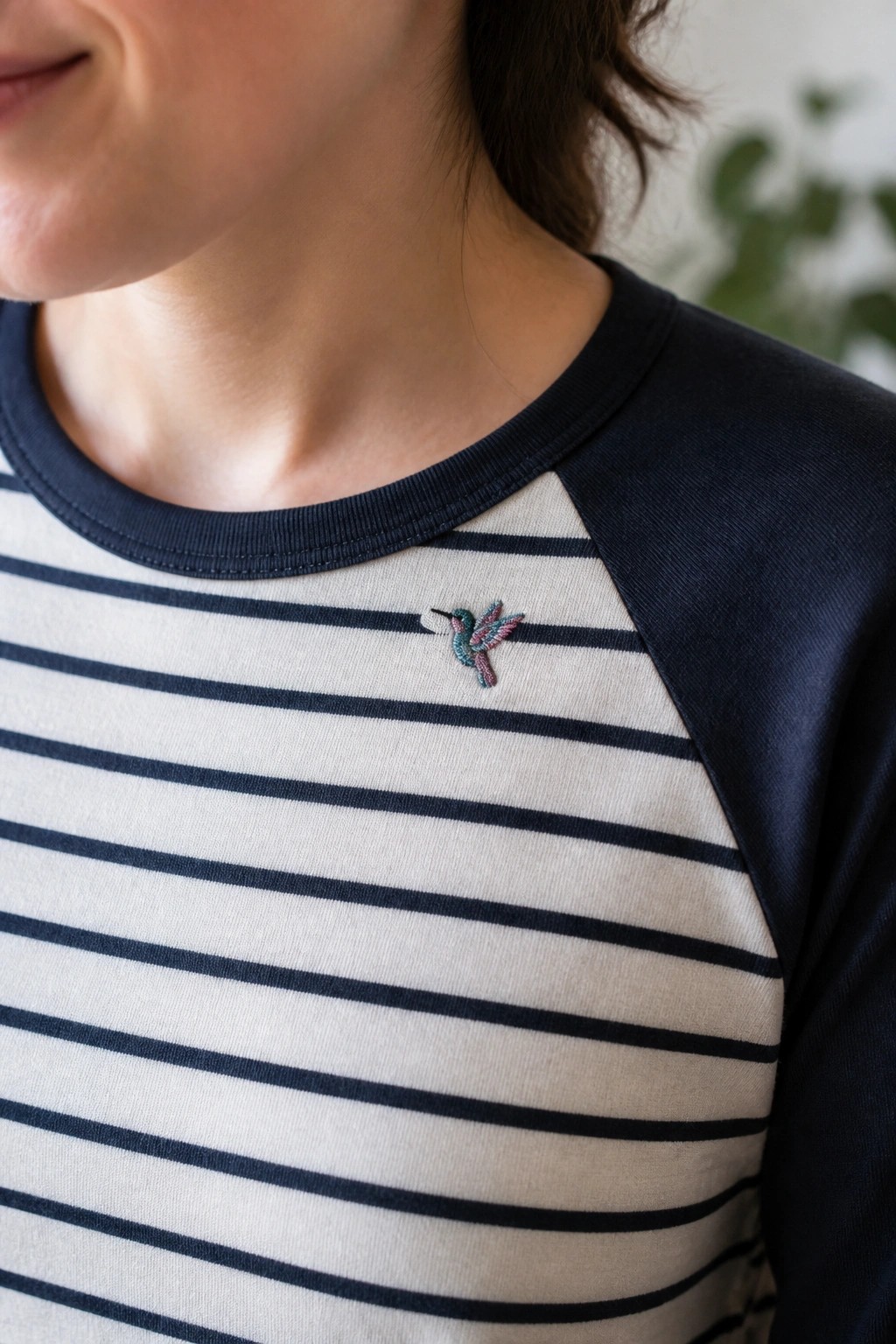 Navy striped raglan shirt with colorful embroidered hummingbird on chest